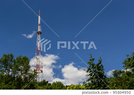 Telecommunication tower for mobile phone with antennas over a blue sky. Distribution function of contract mobile phones Telecommunication tower for mobile phone with antennas over a blue sky. Distribution function of contract mobile phones 95804950