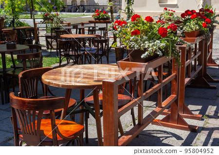Cozy street with cafe tables in Lviv, Ukraine. Summer street cafe Cozy street with cafe tables in Lviv, Ukraine. Summer street cafe 95804952