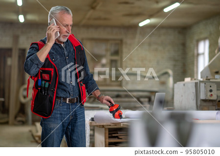 Man talking on the phone and looking involved Man talking on the phone and looking involved 95805010