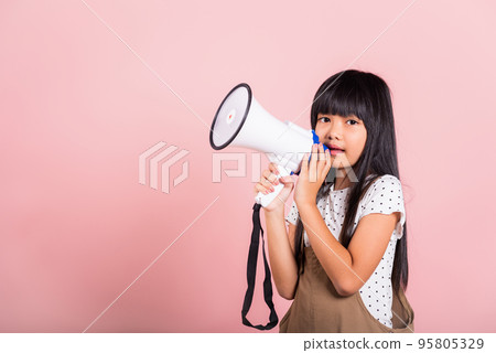 Asian little kid 10 years old shouting by megaphone 95805329