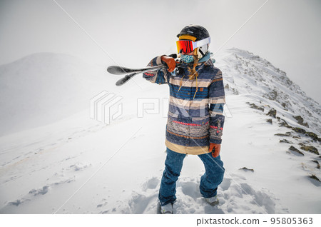 Young woman on a ski vacation in the mountains, portrait. Great rider holiday in ski resort 95805363