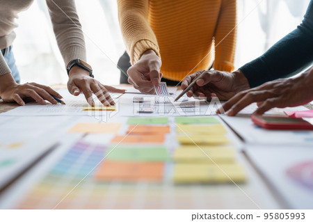 Group of ux developer and ui designer brainstorming about app interface design at modern office. Creative digital development agency Group of ux developer and ui designer brainstorming about app interface design at modern office. Creative digital development agency 95805993