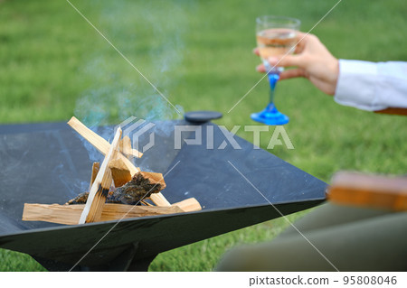 Firewood in the grill on backyard 95808046