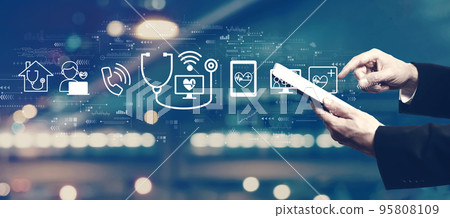 Telemedicine theme with businessman using a tablet 95808109