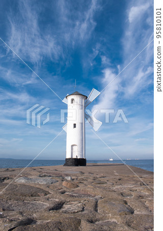 Old windmill lighthouse in Swinoujscie, a port in Poland on the Baltic Sea. Old windmill lighthouse in Swinoujscie, a port in Poland on the Baltic Sea. 95810101