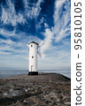 Old windmill lighthouse in Swinoujscie, a port in Poland on the Baltic Sea. 95810105