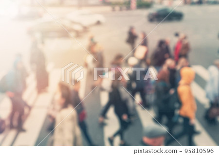 Busy city people on zebra or crosswalk crossing street 95810596
