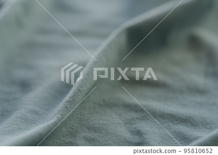 Closeup teal cotton fabric for clothes Closeup teal cotton fabric for clothes 95810652