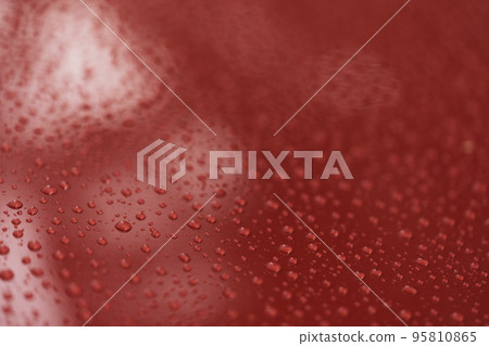 Raindrops on car paint surface after protection treatment 95810865