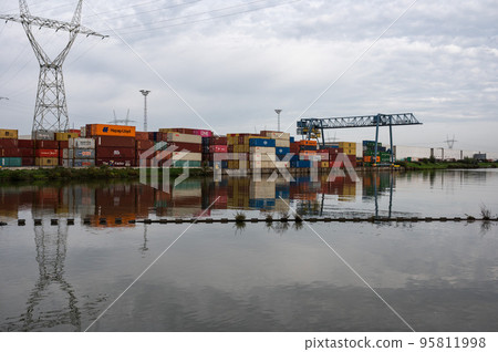 Zemst, Flemish Brabant Region, Belgium  - Cargo containers and industrial crane at the harbor of the river Durme 95811998