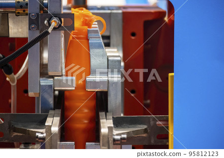 The orange bottle container manufacturing process by blow mold machine. The orange bottle container manufacturing process by blow mold machine. 95812123