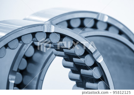 Close up scene of the cylindrical rolling bearing parts. Close up scene of the cylindrical rolling bearing parts. 95812125
