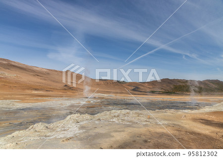 Closeup of Namafjall is Iceland popular geothermal area with a unique landscape of steaming pools and mudpots Closeup of Namafjall is Iceland popular geothermal area with a unique landscape of steaming pools and mudpots 95812302