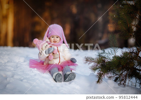 Charming little girl in a warm coat. Charming little girl in a warm coat. 95812444