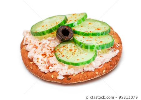 Crispy Cracker Sandwich with Fresh Cucumber, Fish Cream and Olives - Isolated 95813079