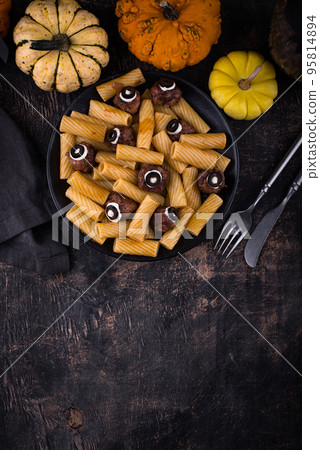 Halloween pasta with meatballs in shape of eye Halloween pasta with meatballs in shape of eye 95814894