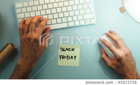 Man making online shopping for black Friday day Man making online shopping for black Friday day 95815738