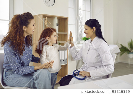 Happy kid and caring doctor give high five Happy kid and caring doctor give high five 95816559