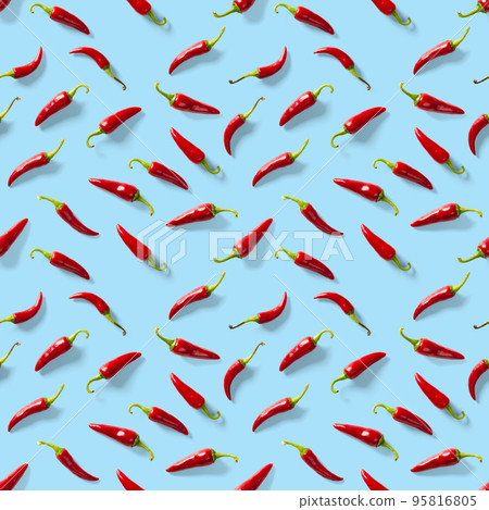 Seamless pattern made of red chili or chilli on blue background. Minimal food pattern. Red hot chilli seamless peppers pattern. Food background. Seamless pattern made of red chili or chilli on blue background. Minimal food pattern. Red hot chilli seamless peppers pattern. Food background. 95816805