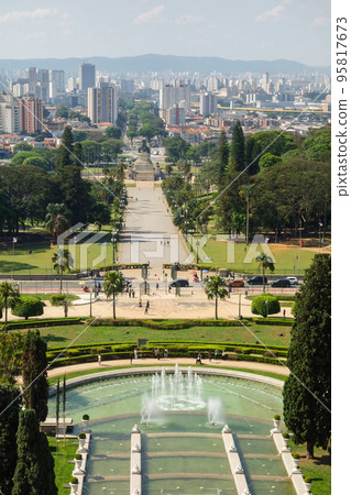 high angle view of Ipiranga Museum garden and fountains with Sao Paulo cityscape as backdrop, Brazil high angle view of Ipiranga Museum garden and fountains with Sao Paulo cityscape as backdrop, Brazil 95817673