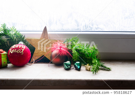 Christmas decorations on windowsil 95818627