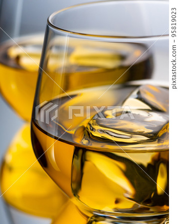 Two glasses of whisky on the rocks 95819023