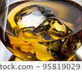 Glass of whisky with ice cubes, close-up shot 95819029