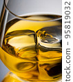 Glass of whisky on the rocks 95819032