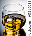 Glass of whisky on the rocks 95819033