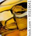 Glass of whisky with ice cubes, close-up shot 95819041
