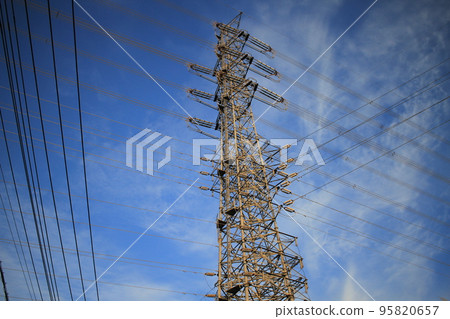 Wires extending intricately into the sky 95820657