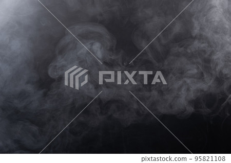 Dense Fluffy Puffs of White Smoke and Fog on black Background, Abstract Smoke Clouds, Movement Blurred out of focus. Smoking blows from machine dry ice fly fluttering in Air, effect texture 95821108