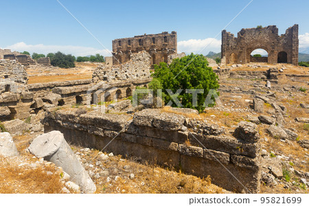 Ruins of the roman bazilica and nymphaeum in the antiquity city of Aspendos 95821699
