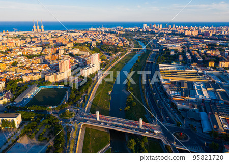 Aerial view of Besos river with Barcelona and Sant Adria on its banks Aerial view of Besos river with Barcelona and Sant Adria on its banks 95821720