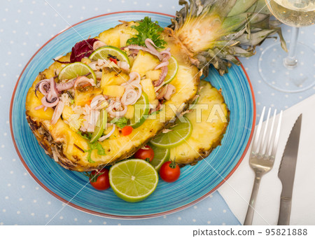 Stuffed pineapple with squid and lime. Stuffed pineapple with squid and lime. 95821888