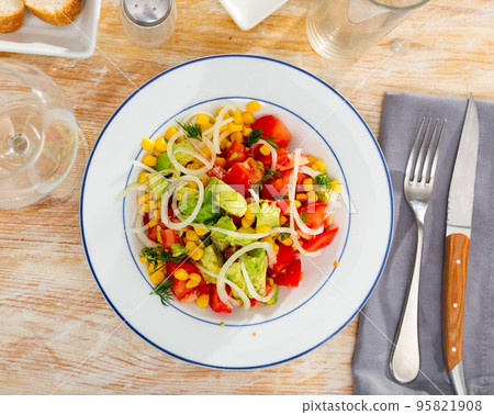 Salad with avocado, corn and tomato Salad with avocado, corn and tomato 95821908
