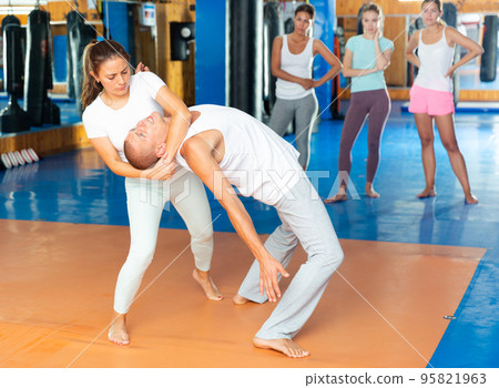 Woman doing self protection movement 95821963