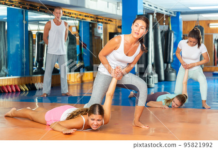 Woman training wristlock movement 95821992