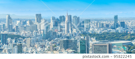 Tokyo cityscape panorama with Shinjuku buildings illuminated by gentle light Tokyo cityscape panorama with Shinjuku buildings illuminated by gentle light 95822245