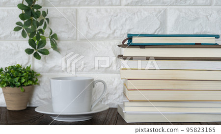 coffee and pile of books 95823165