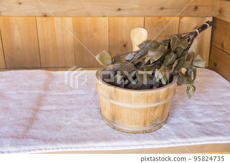 Sauna and water soaked vihta 95824735