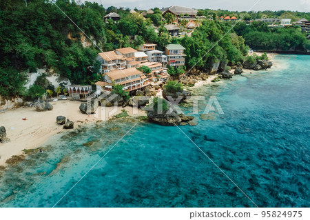 Aerial view of ocean and coastline with hotels on Impossibles beach in Bali 95824975