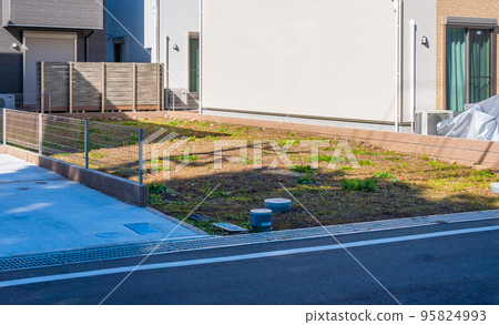 Clearing landscape of newly built residential area 95824993