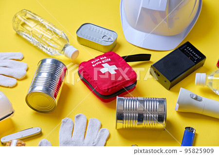 Emergency supplies over yellow background Emergency supplies over yellow background 95825909