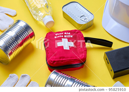 Emergency supplies over yellow background Emergency supplies over yellow background 95825910