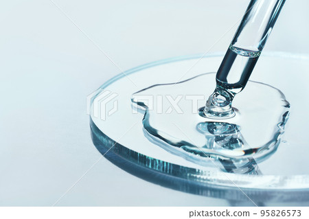 Pipette with sample of cosmetic product in petri dish on blue background, selective focus 95826573