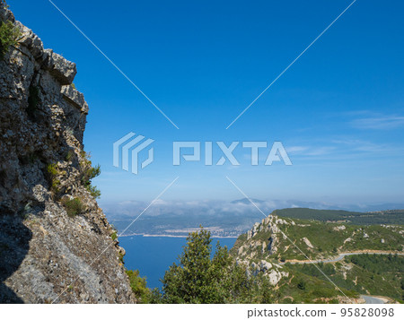 Calanques, France - May 18th 2022: View from Cap Canaille over the route de cretes towards cassis Calanques, France - May 18th 2022: View from Cap Canaille over the route de cretes towards cassis 95828098