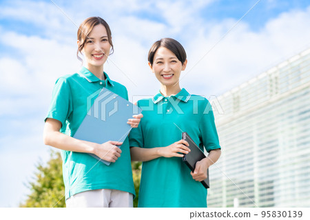 A female manager working in a facility in a uniform A female manager working in a facility in a uniform 95830139