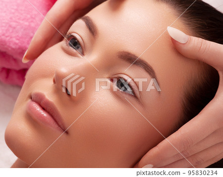 Young girl with thick eyebrows and perfect skin at 95830234