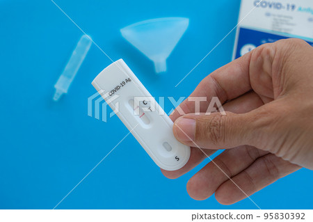 Making Coronavirus antigen test with positive result. Making Coronavirus antigen test with positive result. 95830392